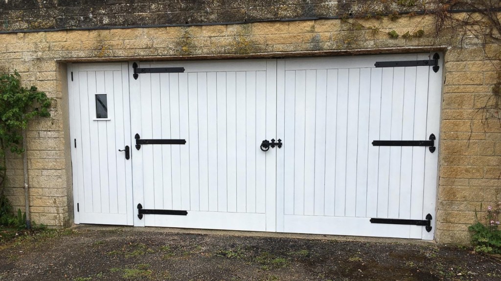 Garage doors with a pedestrian door.